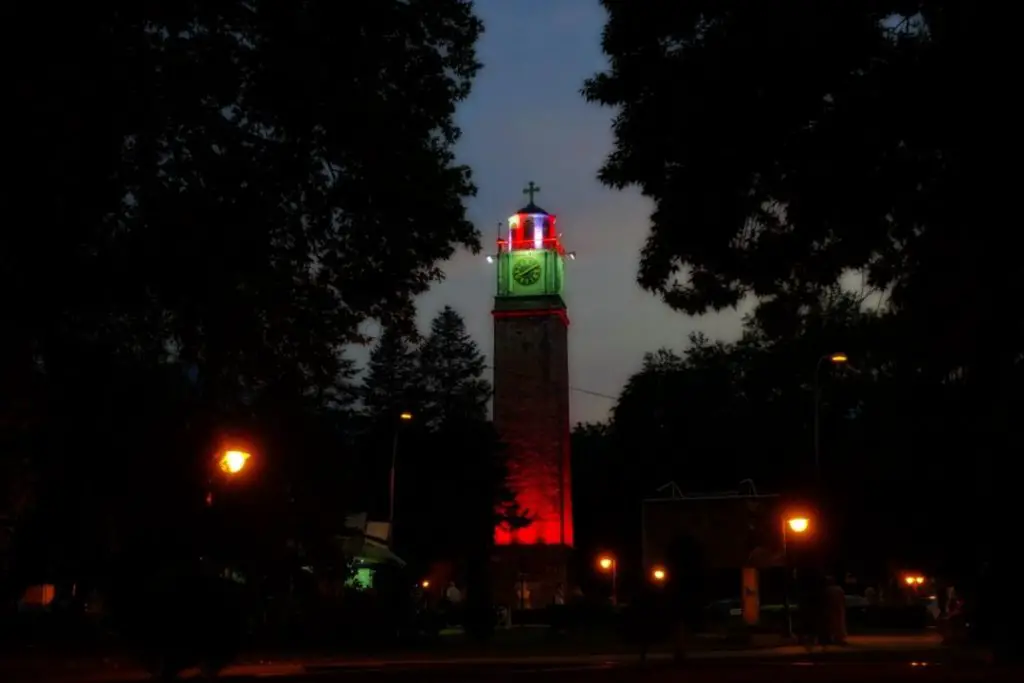 At night, the clock lights up in different colors.