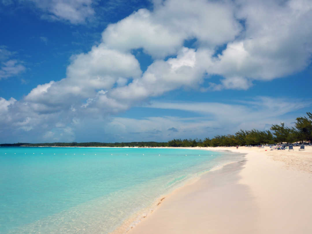 The wide-open beach on Half Moon Cay makes it very easy to get overheated a...