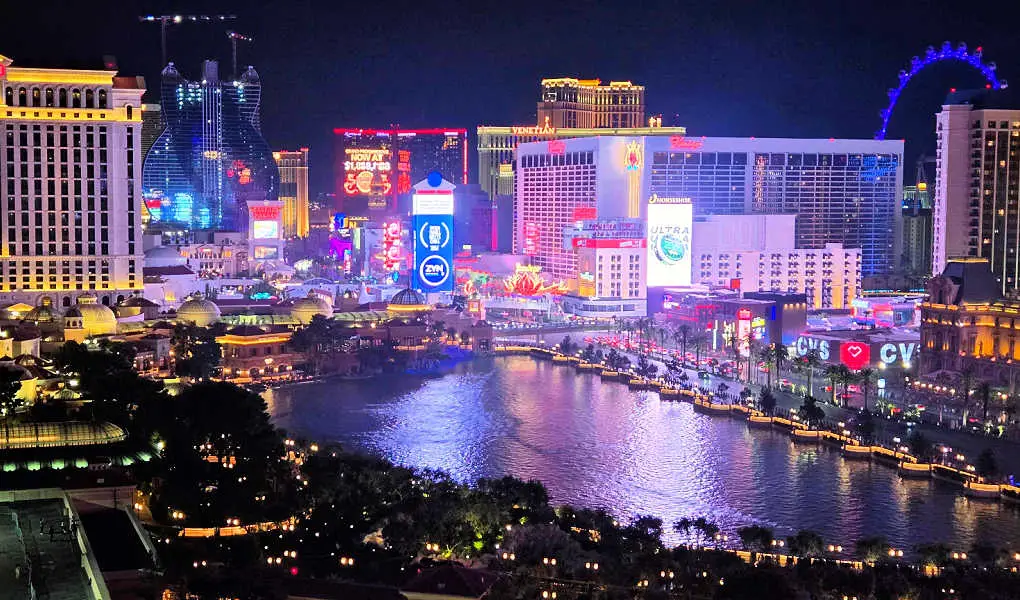 vegas strip at night with large guitar from hard rock hotel in background