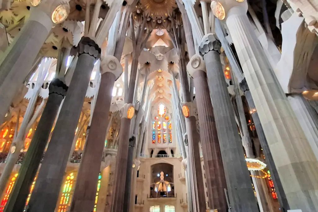 Sagrada Família interior with soaring columns, stained glass windows, and vaulted ceiling, Barcelona
