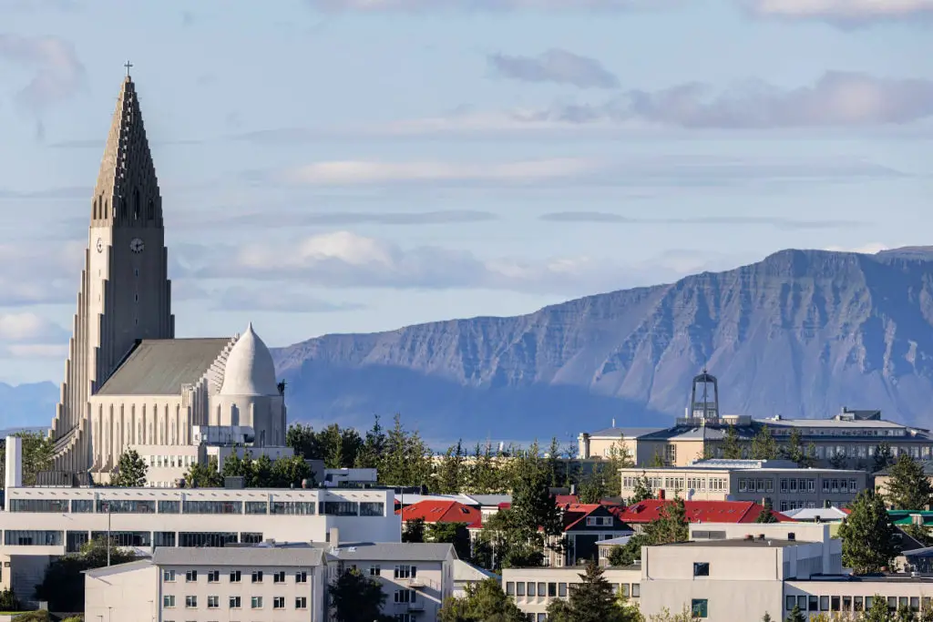 Hallgrímskirkja church in Reykjavik with Icelandic mountains in background