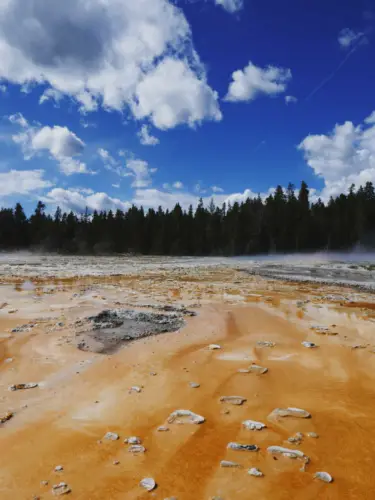 Yellowstone itinerary upper geyser basin orange with clouds